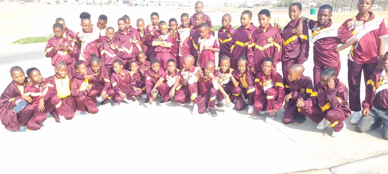 Sports team group photo in maroon tracksuits